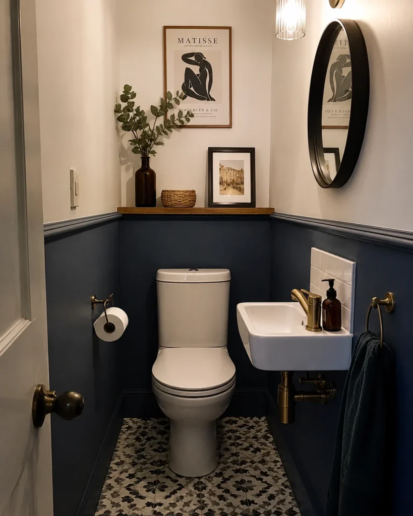 Small downstairs bathroom with contrasting dark lower walls and light upper walls